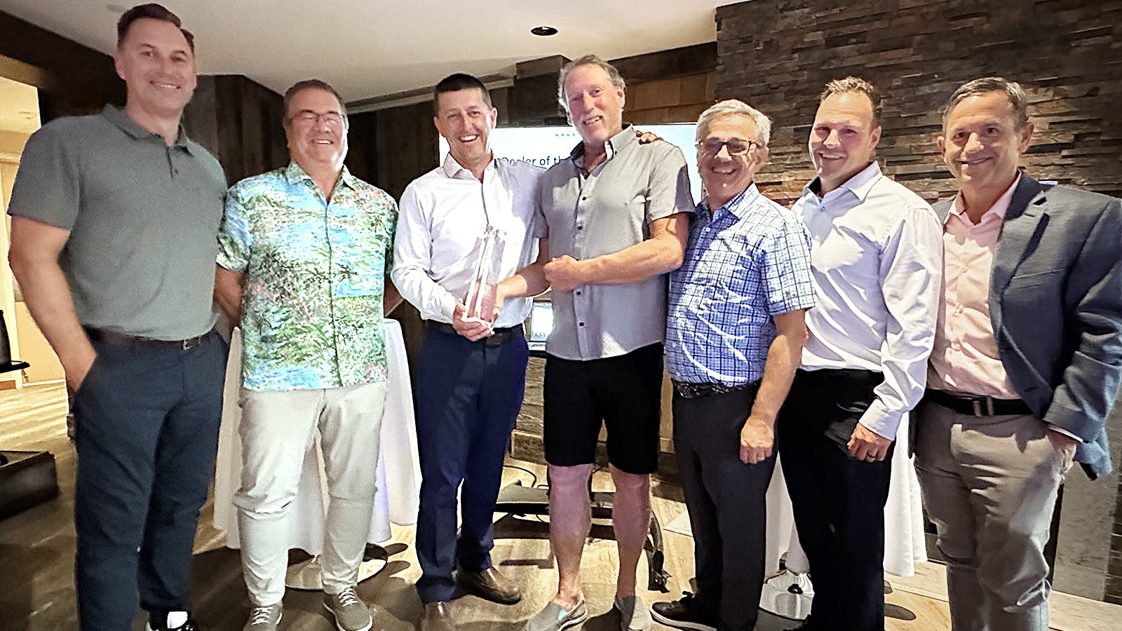 Leaders from Great West Equipment accept their award from Volvo CE. From left: Scott Young, head of region North America, VCE; Colin Matejka, president, Great West; Rob Rintoul, CFO, Great West; Roger Dobie, COO, Great West; Agako Nouch, head of sales development, VCE; Evan Perry, district VP, VCE; Jeff Keller, district sales manager, VCE.