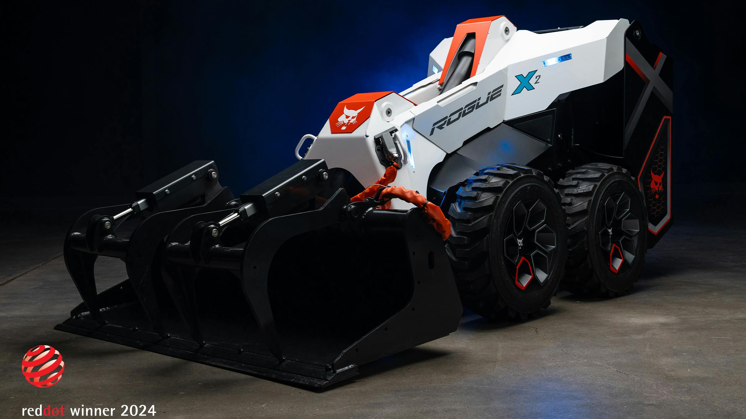 The RogueX2 concept loader on display at CES 2024. The machine produces zero emissions and features a lithium-ion battery, electric drive actuated lift, and tilt kinematics with no hydraulics.