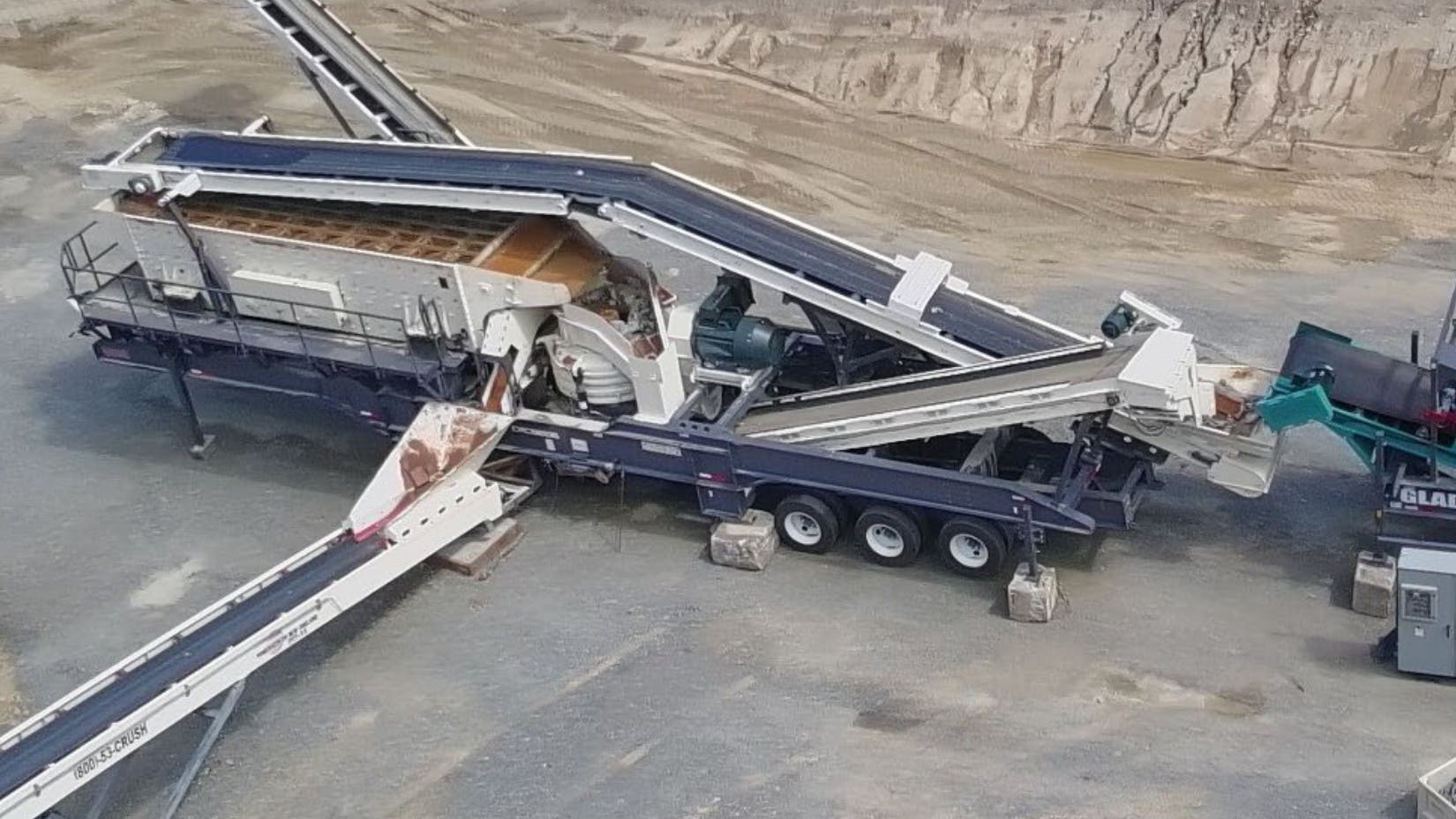 The oversized cone feed hopper has an overflow chute.