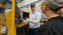 Caterpillar representative demonstrates safety techniques as part of the new program.