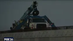 Worker dies in boom truck collapse