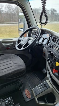 Interior shows little wear because the truck hasn’t been driven much: The odometer showed fewer than 91,000 miles. Allison automatic’s keypad selector is mounted low, though still fairly close at hand for a driver. Stalk on the steering column operates the strong Jake Brake. Interior shows little wear because the truck hasn’t been driven much: The odometer showed fewer than 91,000 miles. Allison automatic’s keypad selector is mounted low, though still fairly close at hand for a driver. Stalk on the steering column operates the strong Jake Brake.