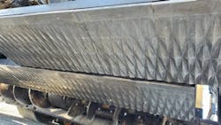 A close look at the Cat Axenox screed. Note the three-dimensional, angular design. It is meant to improve mat density and smoothness. A close look at the Cat Axenox screed. Note the three-dimensional, angular design. It is meant to improve mat density and smoothness.