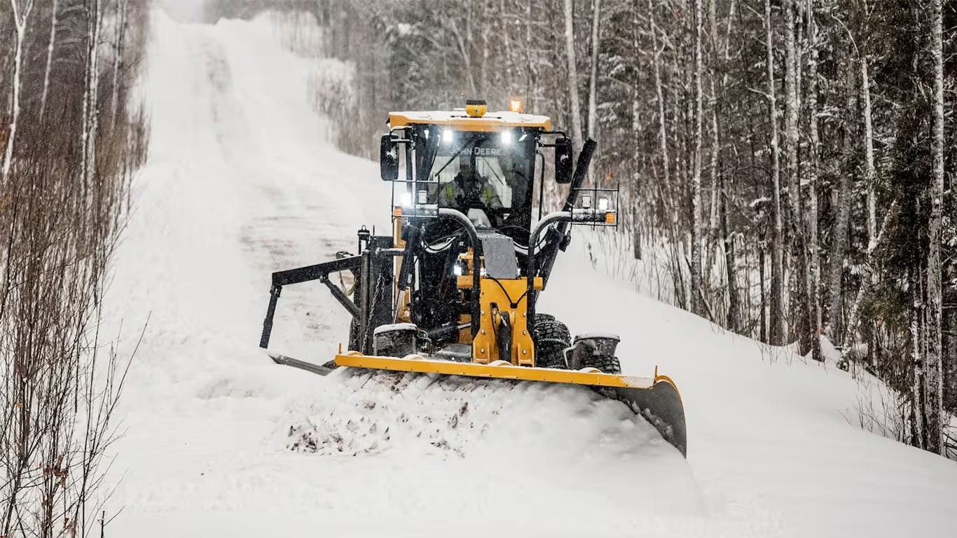 Motor grader using John Deere Path mapping solution for snow removal operation.