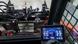 Information from the attachment is displayed in the cab. The 2x2-inch tag is affixed to the attachment (upper part of photo). Information from the attachment is displayed in the cab. The 2x2-inch tag is affixed to the attachment (upper part of photo).