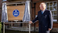 Lord Bamford unveils the blue plaque commemorating JCB's original garage. Lord Bamford unveils the blue plaque commemorating JCB's original garage.