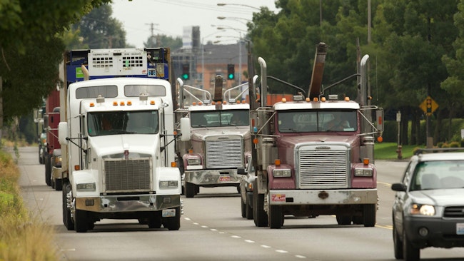 Trucks head for the Port of Portland and the industrial district near Kelley Point Park. City officials said they’re staying the course on Portland’s signature climate policy on replacing diesel with renewable fuels, despite a push to roll it back from an industry-dominated advisory group.
