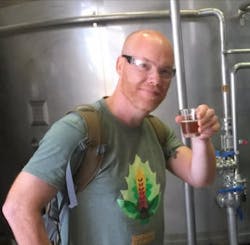 Keith Gribbins with a tiny beer Keith Gribbins with a tiny beer