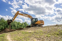 Case CX220E Large Crawler Excavator dumping dirt on a hill Case CX220E Large Crawler Excavator dumping dirt on a hill