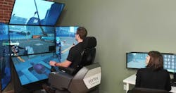 CM Labs Vortex Simulator instructor teaches a student CM Labs Vortex Simulator instructor teaches a student