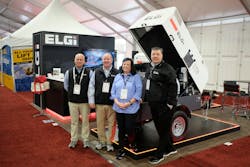 ELGi Compressors booth at a tradeshow, the crew stands for a photo ELGi Compressors booth at a tradeshow, the crew stands for a photo