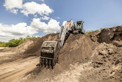 Bobcat E220 excavator with the arm reaching out toward the viewer Bobcat E220 excavator with the arm reaching out toward the viewer