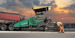 Vögele Super 21005x paving a road with a sunset Vögele Super 21005x paving a road with a sunset