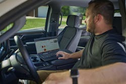 Ditch Witch Orange Intel on a laptop in a contractor's truck. Ditch Witch Orange Intel on a laptop in a contractor's truck.