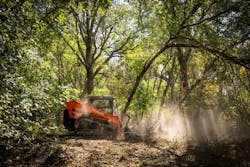 Kubota SVL110 compact track loader brush cutting in the woods. Kubota SVL110 compact track loader brush cutting in the woods.