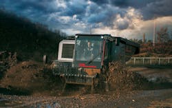 Prinoth Panther T23r Crawler Carrier rolling through the mud. Prinoth Panther T23r Crawler Carrier rolling through the mud.
