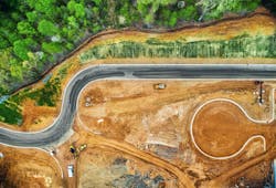 Construction site from above with machines below Construction site from above with machines below