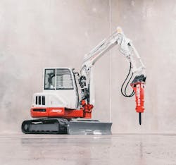 Takeuchi hammer attachment on a mini excavator Takeuchi hammer attachment on a mini excavator