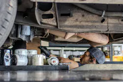Fleetio mechanic working underneath a vehicle Fleetio mechanic working underneath a vehicle