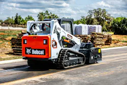 Bobcat T595 compact track loader with a sweeper attachment Bobcat T595 compact track loader with a sweeper attachment