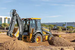 John Deere backhoe loader pushing dirt John Deere backhoe loader pushing dirt