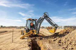 John Deere backhoe digging a trench John Deere backhoe digging a trench
