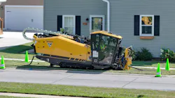 Vermeer D24 horizontal directional drill with cab drilling by house. Vermeer D24 horizontal directional drill with cab drilling by house.