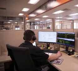 JLG Virtual Remote Assistant man on a call looking at a computer screen JLG Virtual Remote Assistant man on a call looking at a computer screen