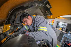 A mechanic working a JCB telehandler A mechanic working a JCB telehandler