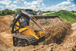 John Deere 333G P-Tier SmartGrade compact track loader, digging dirt. John Deere 333G P-Tier SmartGrade compact track loader, digging dirt.