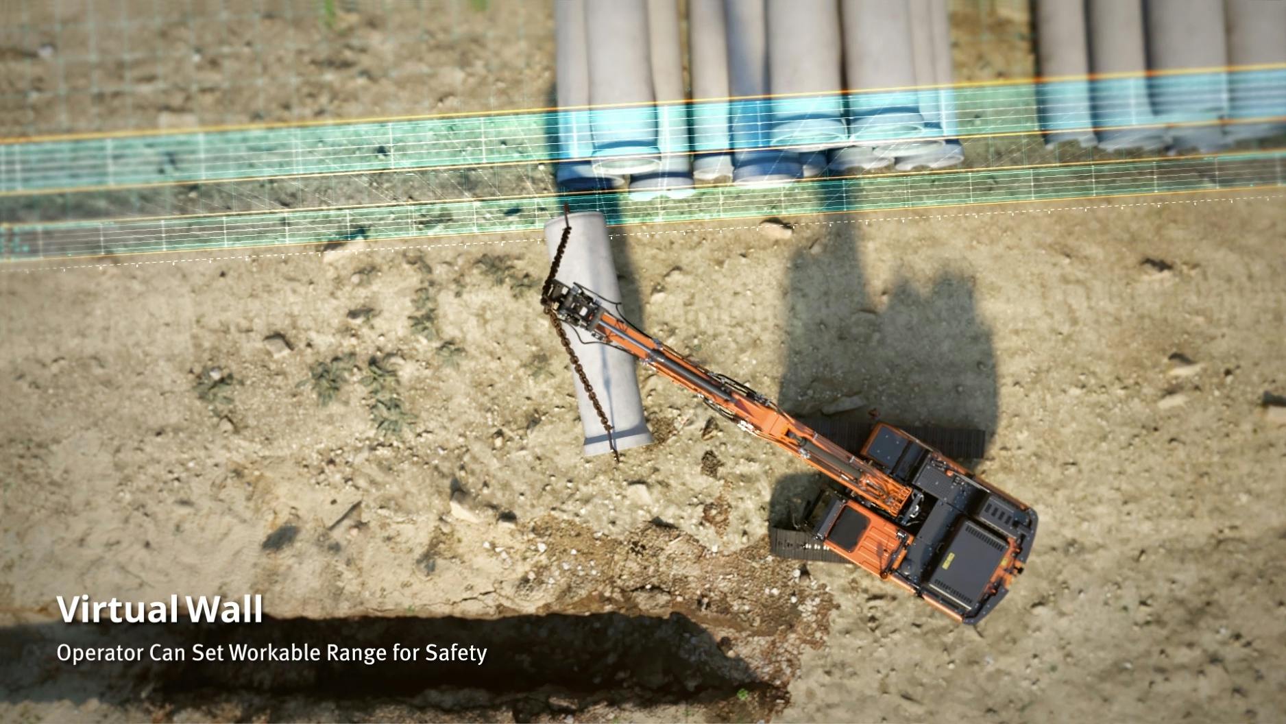 Develon excavator uses Virtual Wall technology while holding a pipe.