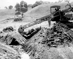 Gradall No. 3 machine digging a near with precision. Gradall No. 3 machine digging a near with precision.