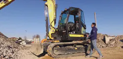 TEXA mechanic working on a Yanmar excavator TEXA mechanic working on a Yanmar excavator
