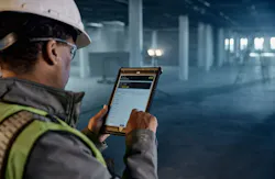 Dewalt Ecomm Tool connect image. Man on tablet inside building. Dewalt Ecomm Tool connect image. Man on tablet inside building.