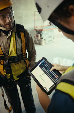 Dewalt Ecomm Tool Connect. Man talking with scissor lift in background.. Dewalt Ecomm Tool Connect. Man talking with scissor lift in background..