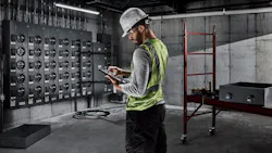 Dewalt Ecomm software. Man using tablet during construction. Dewalt Ecomm software. Man using tablet during construction.