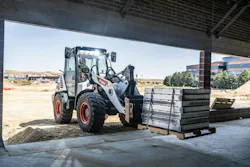 Bobcat L95 compact wheel loader carrying pallets. Bobcat L95 compact wheel loader carrying pallets.
