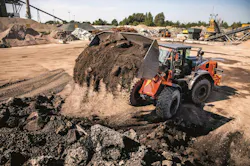 Hitachi Construction Machinery ZW220-7 wheel loader dumping dirt. Hitachi Construction Machinery ZW220-7 wheel loader dumping dirt.