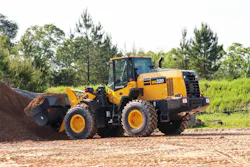 Komatsu WA320-8 wheel loader digging into a dirt pile. Komatsu WA320-8 wheel loader digging into a dirt pile.
