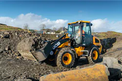 JCB 409 wheel loader carrying dirt JCB 409 wheel loader carrying dirt