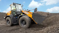 Case 421G wheel loader carrying a bucket of dirt. Case 421G wheel loader carrying a bucket of dirt.