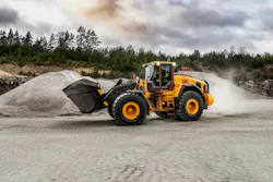 Volvo L220 wheel loader carrying a bucket of dirt. Volvo L220 wheel loader carrying a bucket of dirt.