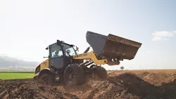 New Holland Construction W100D wheel loader carrying dirt. New Holland Construction W100D wheel loader carrying dirt.