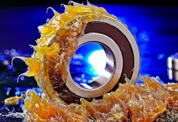 Sticky yellowish grease sticking on a component. Sticky yellowish grease sticking on a component.