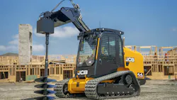 JCB compact track loader using an auger attachment. JCB compact track loader using an auger attachment.