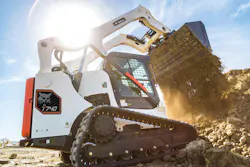 Bobcat compact track loader dumping dirt. Bobcat compact track loader dumping dirt.
