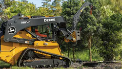 John Deere MB60 material boom attachments holding a tree. John Deere MB60 material boom attachments holding a tree.