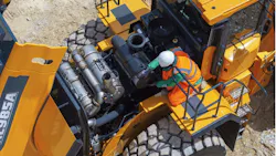 Technician servicing loader Technician servicing loader