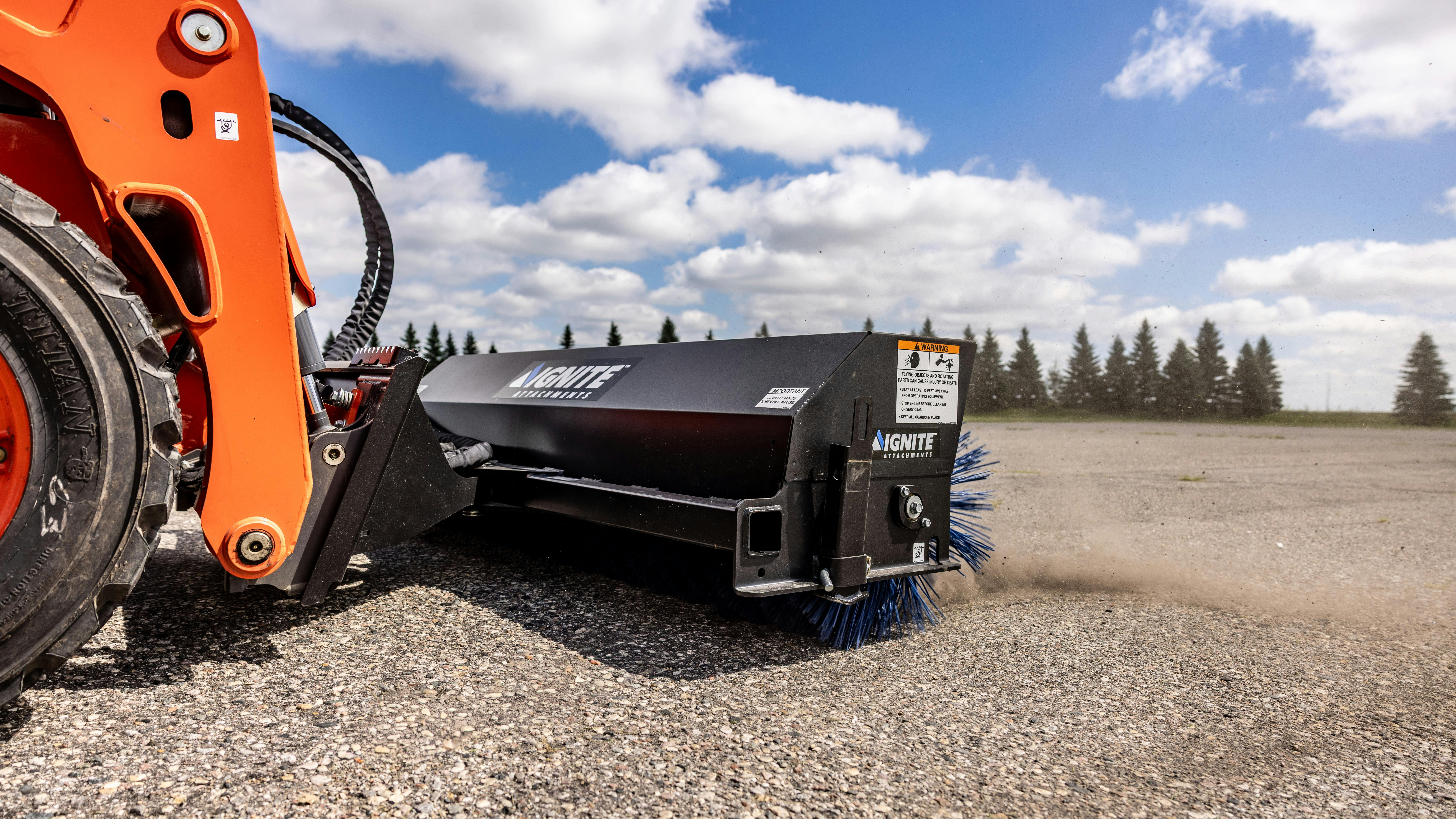 Ignite angle broom 72 inch model on a skid steer.