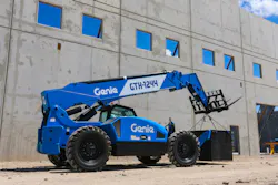 Genie GTH-1244 telehandler carrying a crate. Genie GTH-1244 telehandler carrying a crate.